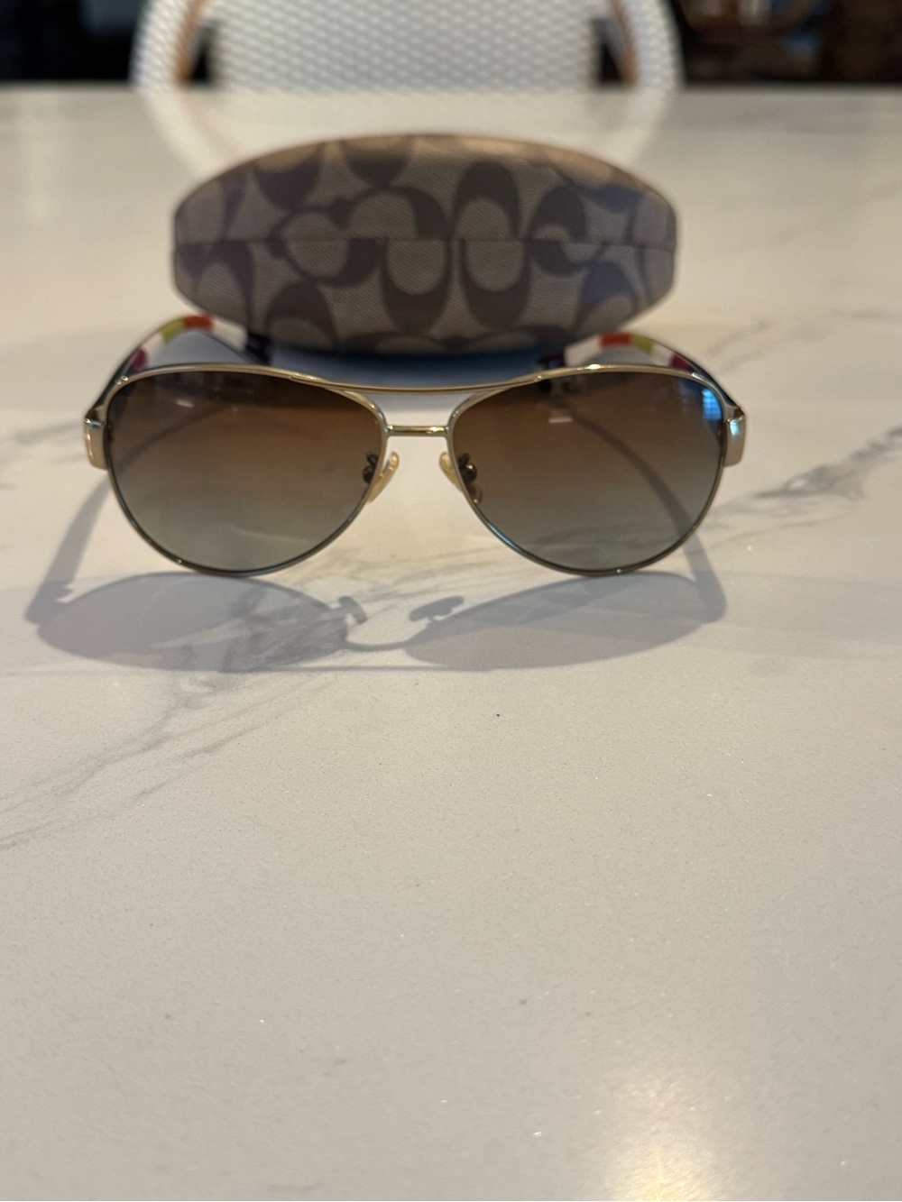 Coach Kristina HC7003 Aviator Gold Frame Sunglasses with Brown Gradient Lenses